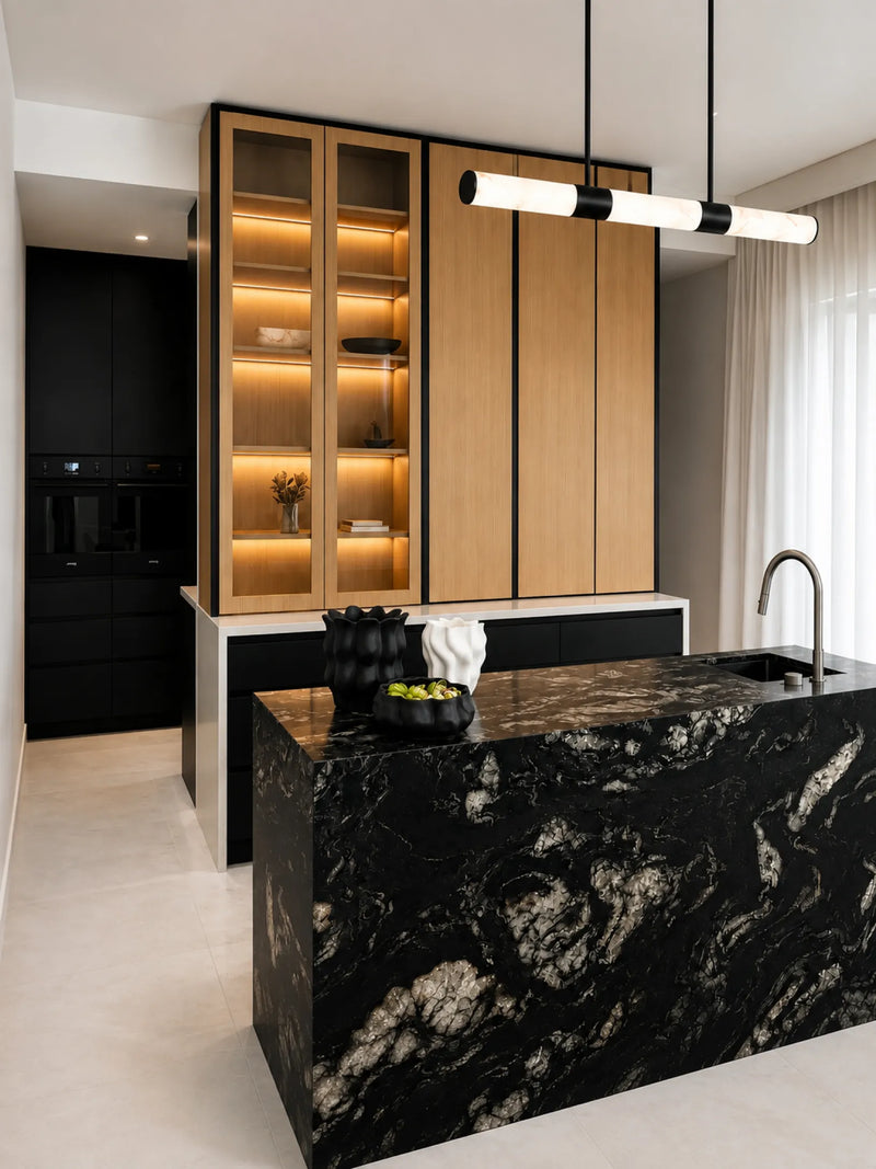 Black marble kitchen island with timber cabinetry and lit glass display cabinets